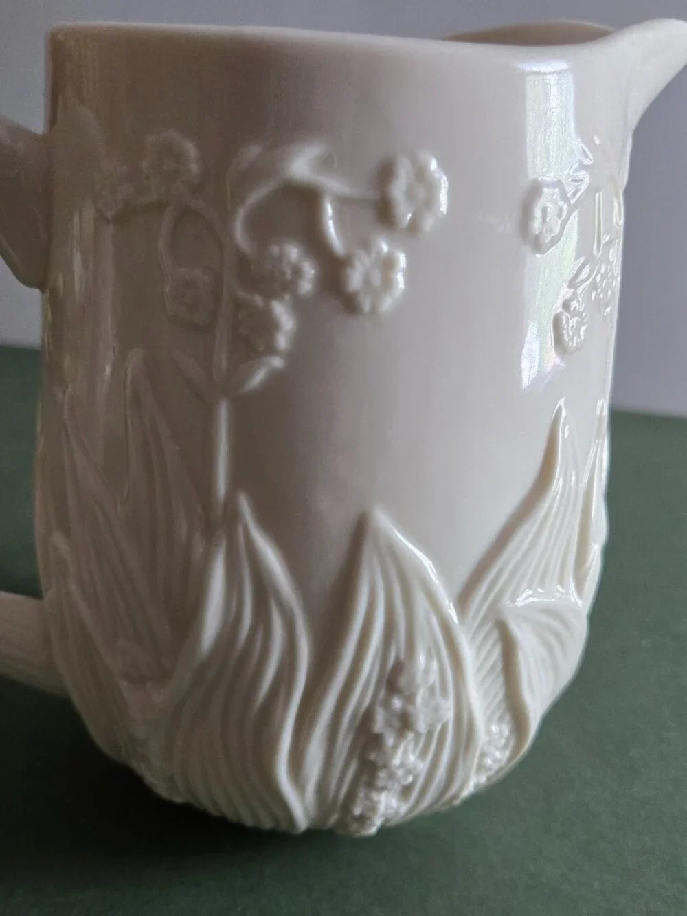 Pair of Ivory Bisque Pitchers